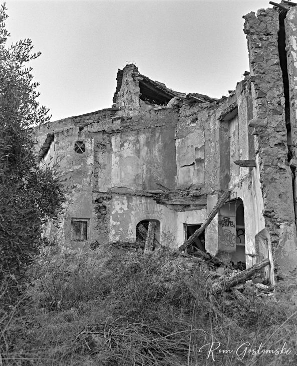 Behind the front facade of the abandoned cortijo